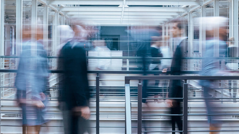 business-people-talking-in-corridor-PSVCLEM(1)